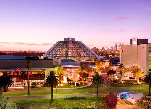 a view of the louvre pyramid at night at Crown Metropol Perth in Perth