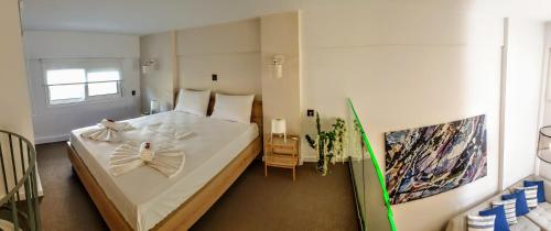 Postel nebo postele na pokoji v ubytování City House Loft