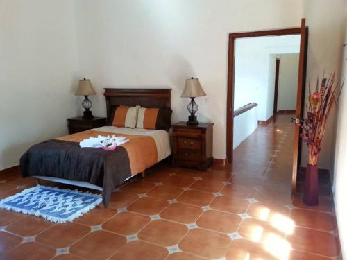 Postel nebo postele na pokoji v ubytování HOTEL ECOTURISTICO LA SALITRERA