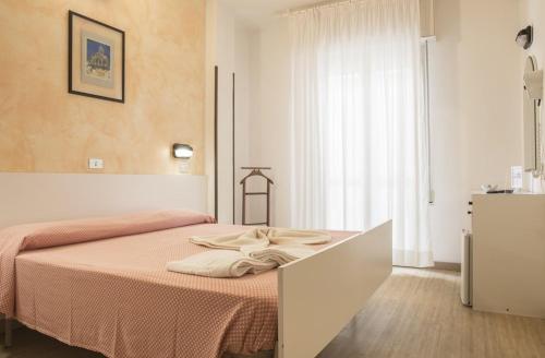 Postel nebo postele na pokoji v ubytování Hotel Alba