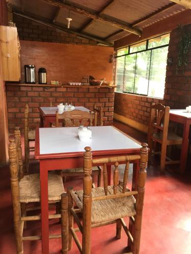 a dining room with a wooden table and chairs at Jo´s Place in Huaraz