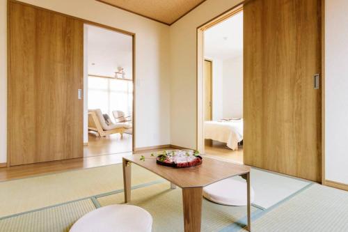 a living room with a coffee table and a living room at Akiba Residence in Tokyo