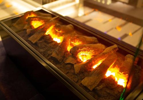 a bunch of food is cooking in an oven at HOTEL U's 香櫨園 in Nishinomiya