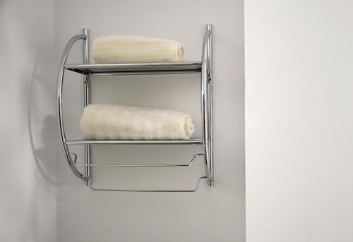 a towel rack hanging on a wall with towels at Ayana Central House in Oradea