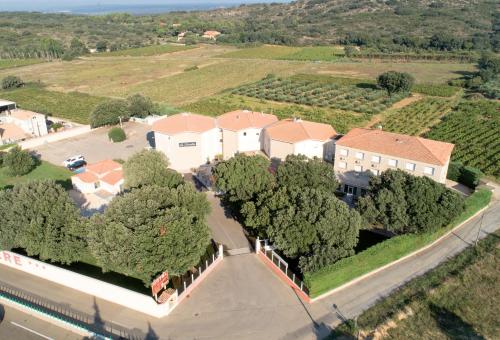 an aerial view of a house with trees and a road at greet hôtel Pont du Gard - Route d'Avignon in Estézargues