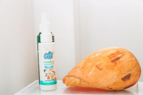 a bottle of oil next to a loaf of bread at ANB Surf View in Tangalle