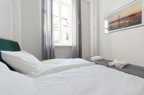 Posteľ alebo postele v izbe v ubytovaní Apartament Mickiewicza