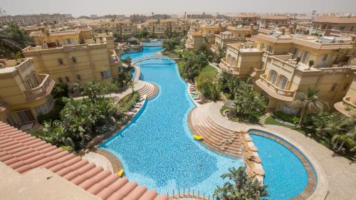 an aerial view of a pool in a resort at El Safwa Resort New Cairo in Cairo