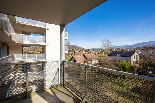a balcony with a view of a house at Résidence Azurea in Aix-les-Bains