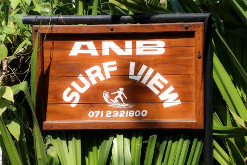 a sign that says an end of wind on a wall at ANB Surf View in Tangalle