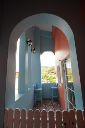an archway in a house with a window at Wonderful Kenting Hostel in Eluan