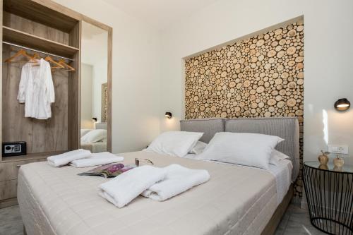 Postel nebo postele na pokoji v ubytování NK Apartments