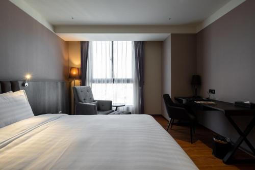 Postel nebo postele na pokoji v ubytování Lai Hotel