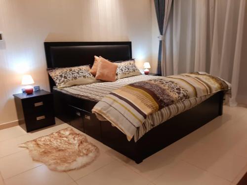 
A bed or beds in a room at Marina beach view 3 bedroom apartment sky nest home sky view tower
