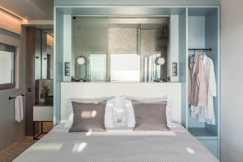Postel nebo postele na pokoji v ubytování Urban Suites
