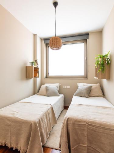 En eller flere senge i et værelse på Homing Barcelona 101
