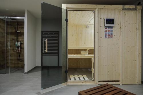 a bathroom with a shower and a sink at Alpenpension Haslinger in Bad Gastein