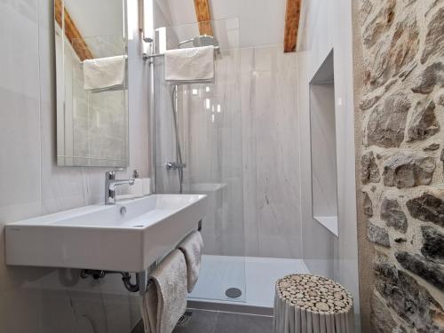 a white bathroom with a sink and a shower at FJAKA Boutique Apartments in Split