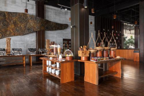 a large room with tables with food on display at Eskala Hotels and Resorts in Ngwesaung