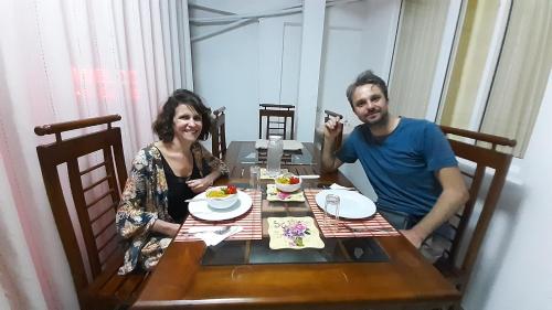 a man and a woman sitting at a table at DAM HOUSE (Near Adams Peak) in Maskeliya