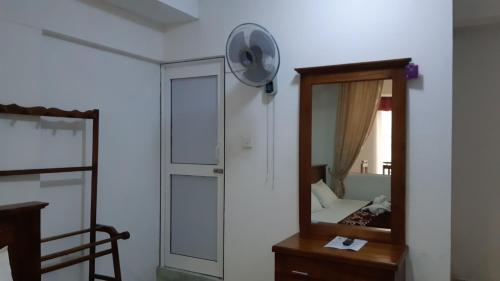 a room with a mirror and a door and a mirror at DAM HOUSE (Near Adams Peak) in Maskeliya