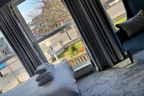 a room with a bed and a large window at The Lord Street Hotel; BW Signature Collection in Southport