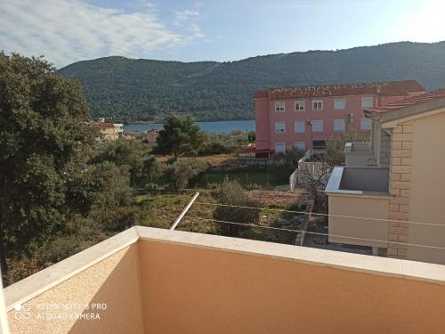 a view from the balcony of a building at Apartments Ana in Grebaštica
