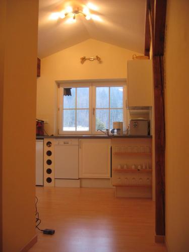 a kitchen with a sink and a window in it at Ferienwohnung Haus Datz in Berchtesgaden in Berchtesgaden
