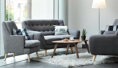 a living room with two chairs and a coffee table at Hestia Hotel Ilmarine in Tallinn