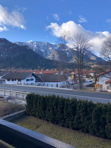 a view of a road with mountains in the background at Alpenhotel Gastager in Inzell
