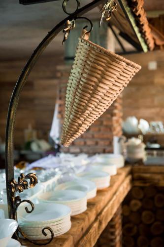 a table topped with white bowls and plates at Guest House Sofia in Kobuleti