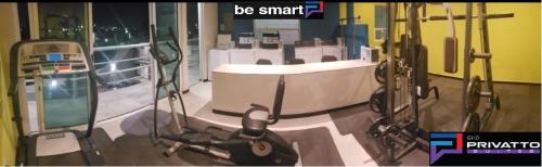 a picture of a gym with a bath tub in a room at Privatto Suites in Saltillo
