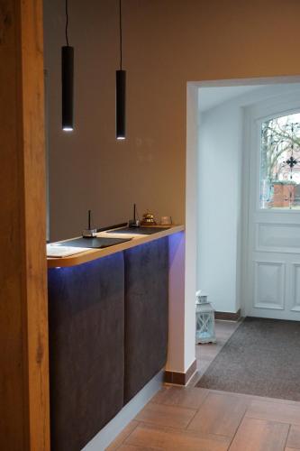 a kitchen with a sink and a counter top at Hotel Grüner Baum in Kaufbeuren