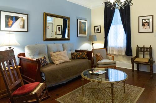 a living room with a couch and a table at The Blue60 Marigny Inn in New Orleans