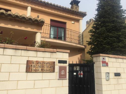 a building with a sign on the side of it at Casa Peseta, Casa Rural in Vallada