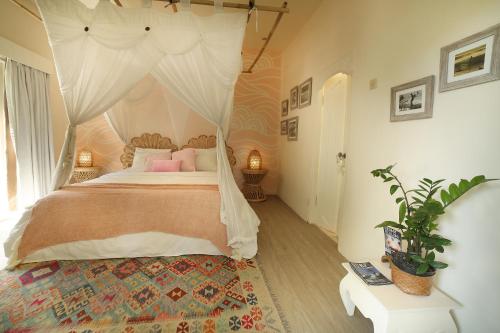 A bed or beds in a room at The Chillhouse - Bali Surf and Yoga Retreat