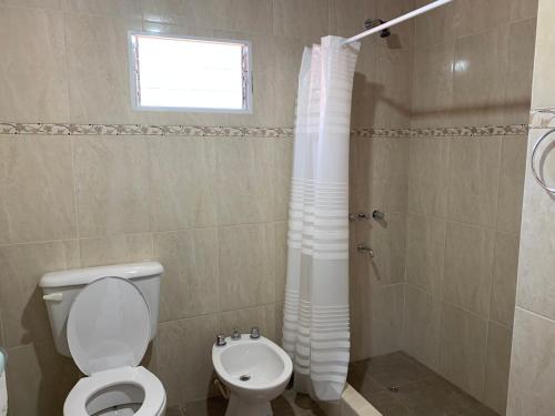a bathroom with a toilet and a shower at Like Home in Salta