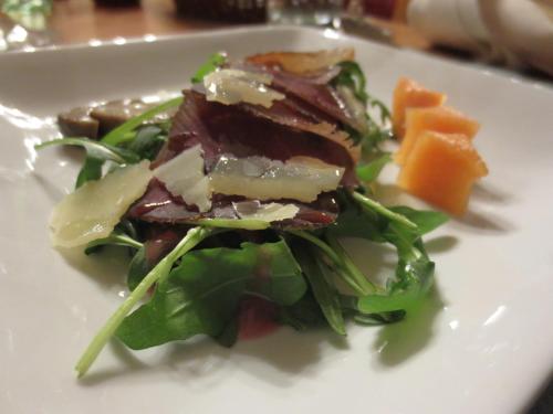 a white plate with a salad and carrots on it at Wohlfühlhotel Goiserer Mühle in Bad Goisern