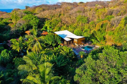 an aerial view of a house in the forest at Pousada do Vale in Fernando de Noronha