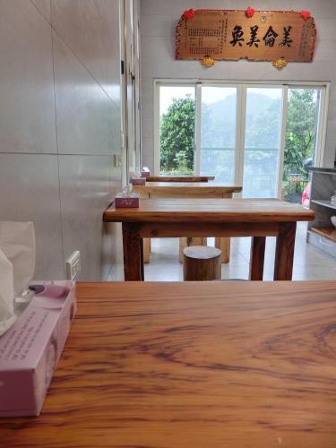 a room with a table with a laptop on a table at Taitung Crabs House in Chenggong