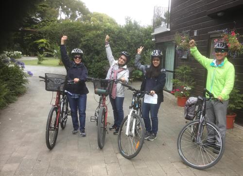 a group of people posing with their bikes at Antares Homestay in Renwick