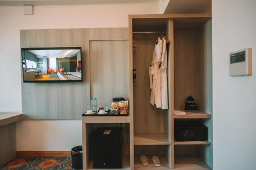 a room with a closet with a mirror at Ritz Grand Hotel Mandalay in Mandalay