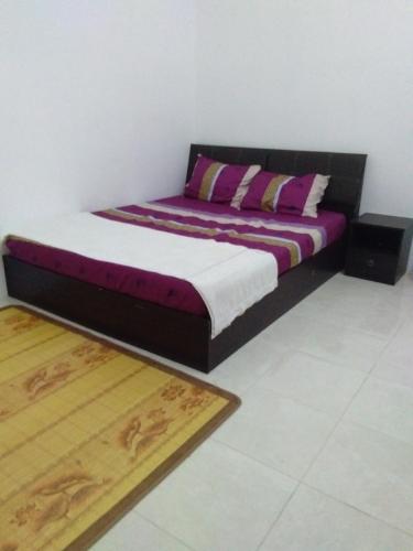 Ένα ή περισσότερα κρεβάτια σε δωμάτιο στο Alif Homestay Changlun