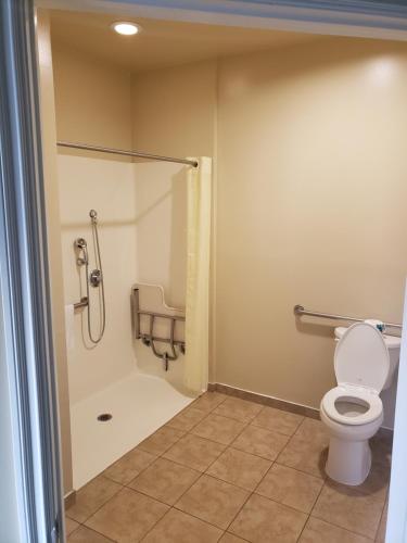 a bathroom with a toilet and a shower stall at Hotel Portlight in Wilmington