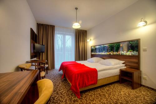Postel nebo postele na pokoji v ubytování Hotel Łańcut