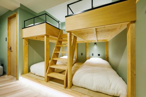 Postel nebo postele na pokoji v ubytování mizuka Daimyo 7 - unmanned hotel -