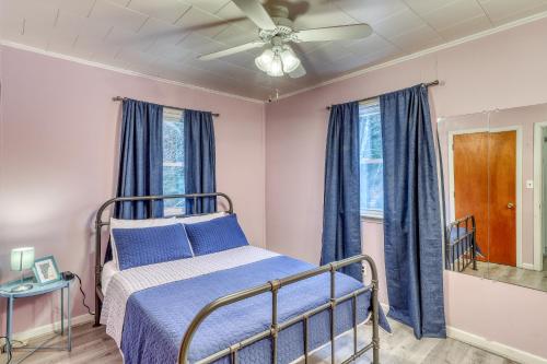 a bedroom with a bed and a ceiling fan at Hermitville in Rutland