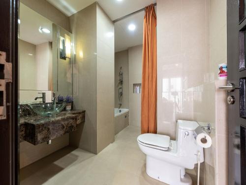 a bathroom with a toilet and a sink and a shower at Sunway Suite 4pax 1min to Pyramid Mall Sunway Lagoon in Petaling Jaya