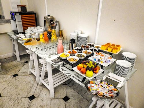 a table with many plates of food on it at Hotel Sobienie Królewskie in Sobienie Szlacheckie