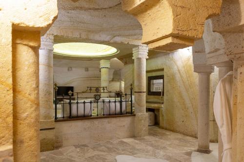 a room with columns and a ceiling in a building at Zeydem Suites in Urgup